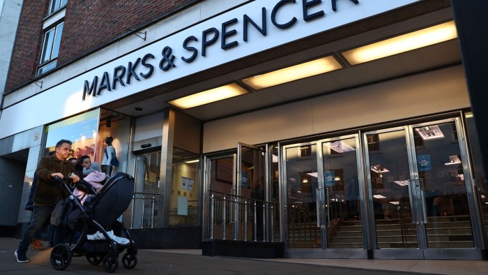 Shoppers outside a M&S store