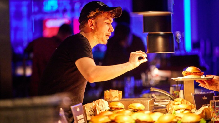 A chef making burgers