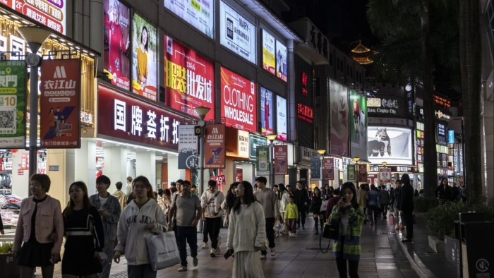 Pedestrians on the Dongmen Old Street shopping area in Shenzhen