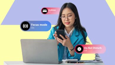 A Woman At A Desk Looking At Her Phone With Bedtime Focus Mode And Do Not Disturb Ui Labels Displaye Avif