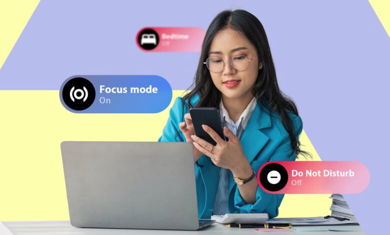 A Woman At A Desk Looking At Her Phone With Bedtime Focus Mode And Do Not Disturb Ui Labels Displaye Avif