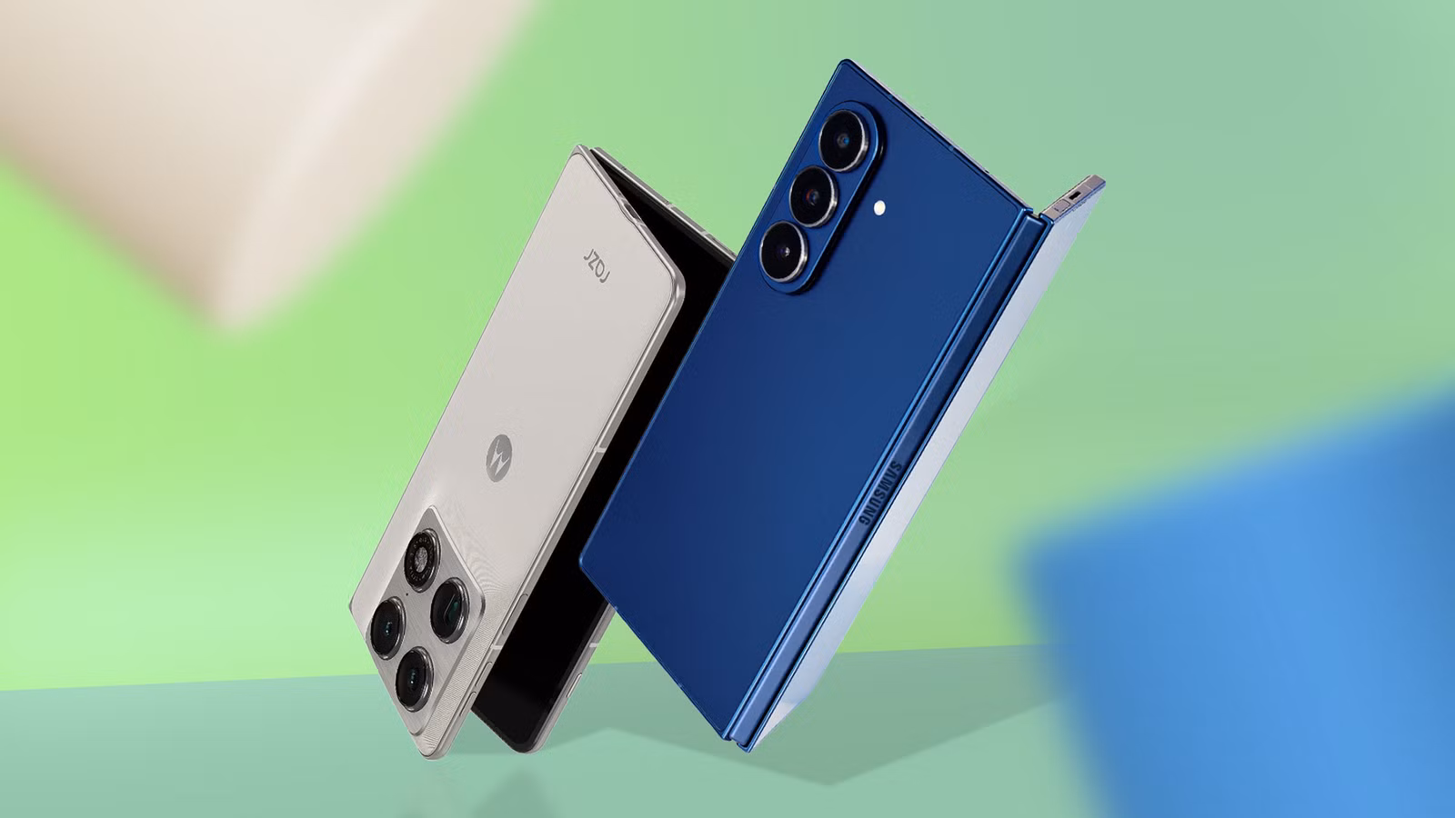 a motorola razr fold and a samsung galaxy z fold7 partially unfolded against a gradient background j avif