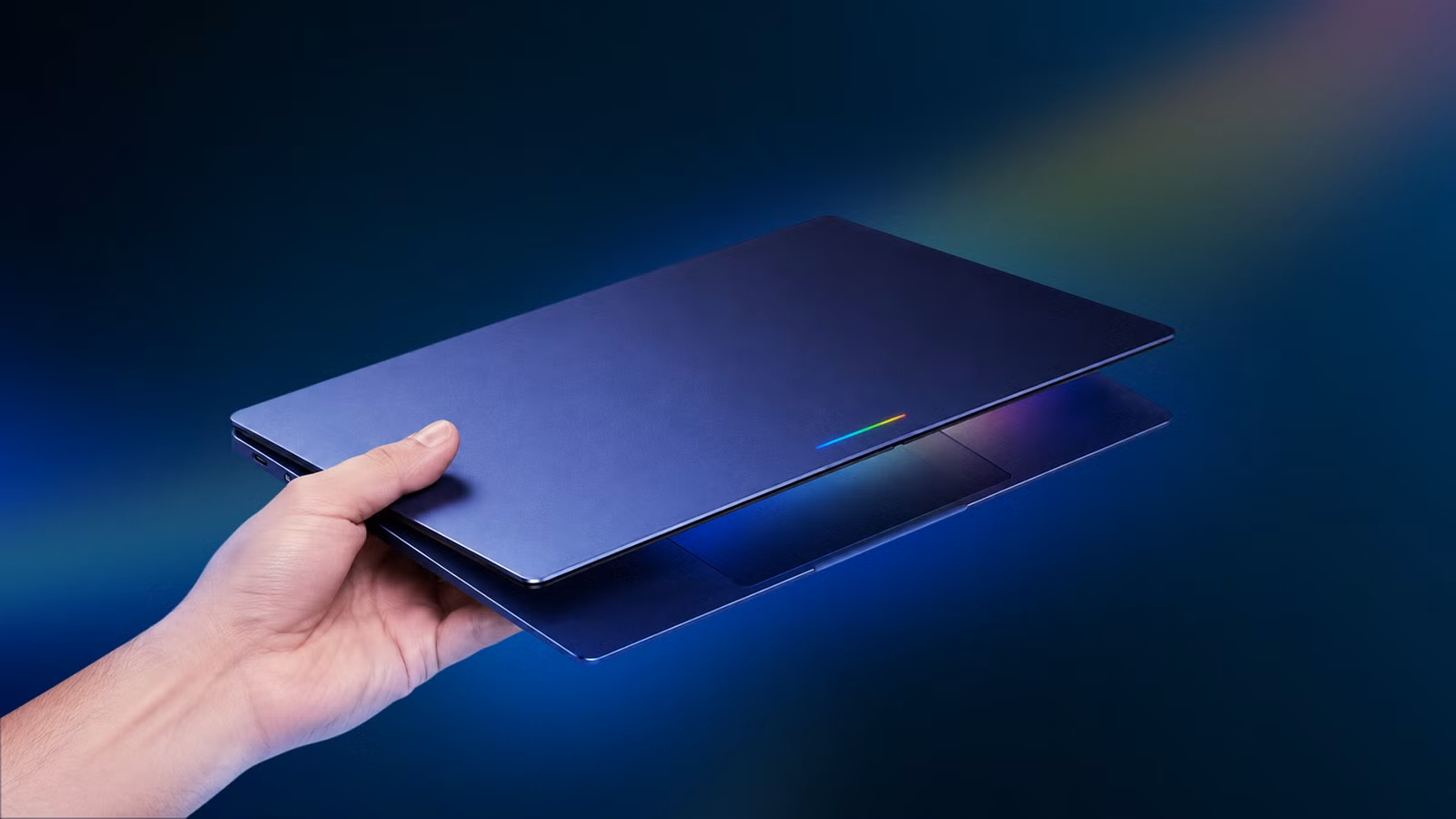 hand holding a googlebook laptop on a dark blue gradient background png