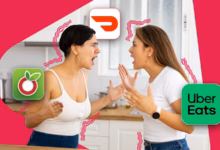 Two Roommates Arguing In A Kitchen With Ourgroceries Doordash And Uber Eats App Icons Around Them Pn  Avif