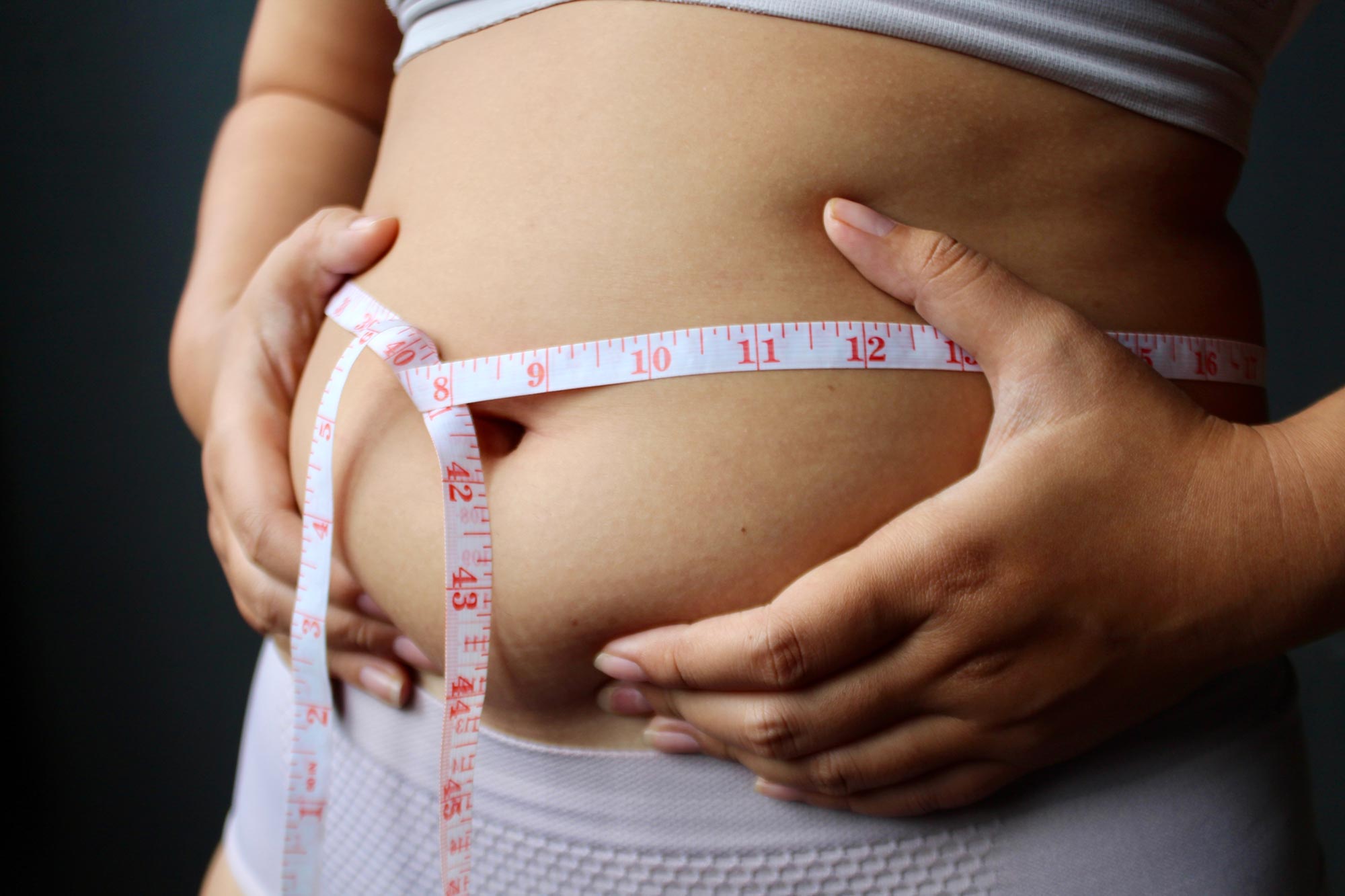 Belly Fat Weight Loss Woman Measuring Waist Tape Measure jpg