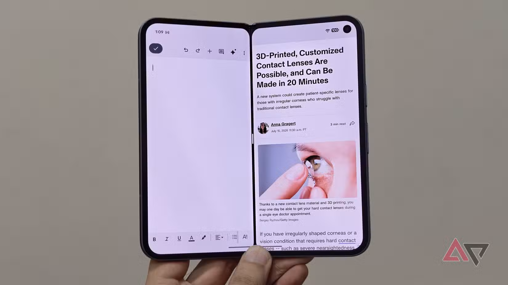 Real-world split-screen multitasking on the Google Pixel Fold showing simultaneous text editing and web article reading