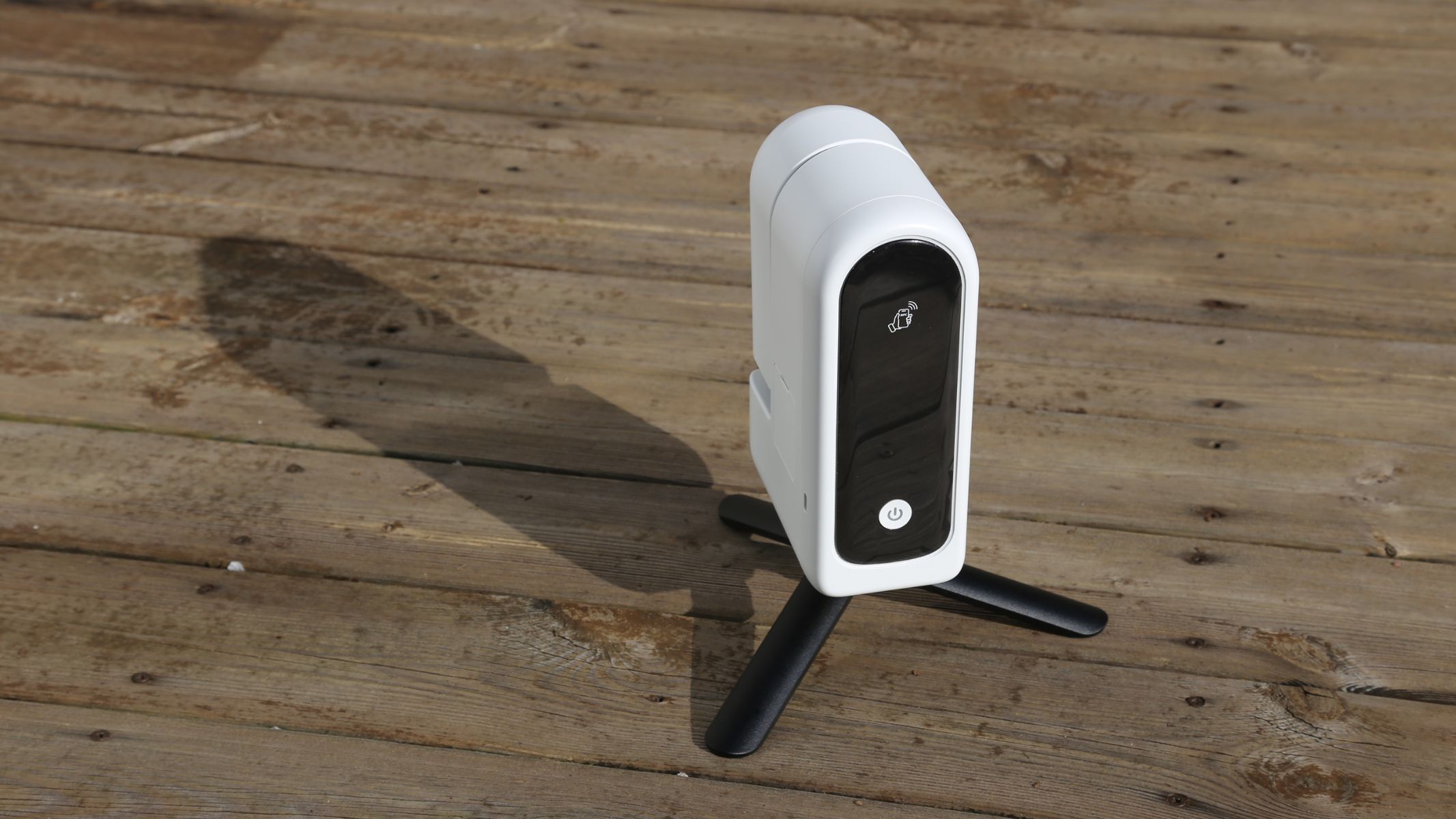 The ZWO Seestar S30 Pro mounted on a tripod on a wooden table.