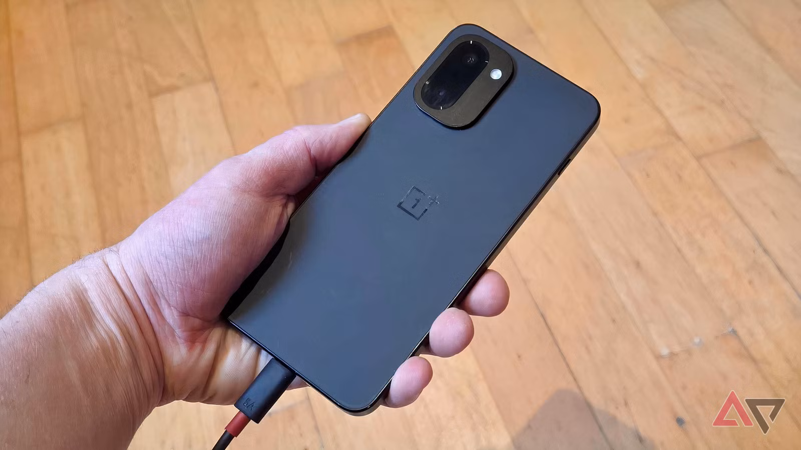oneplus 15r battery hand jpg