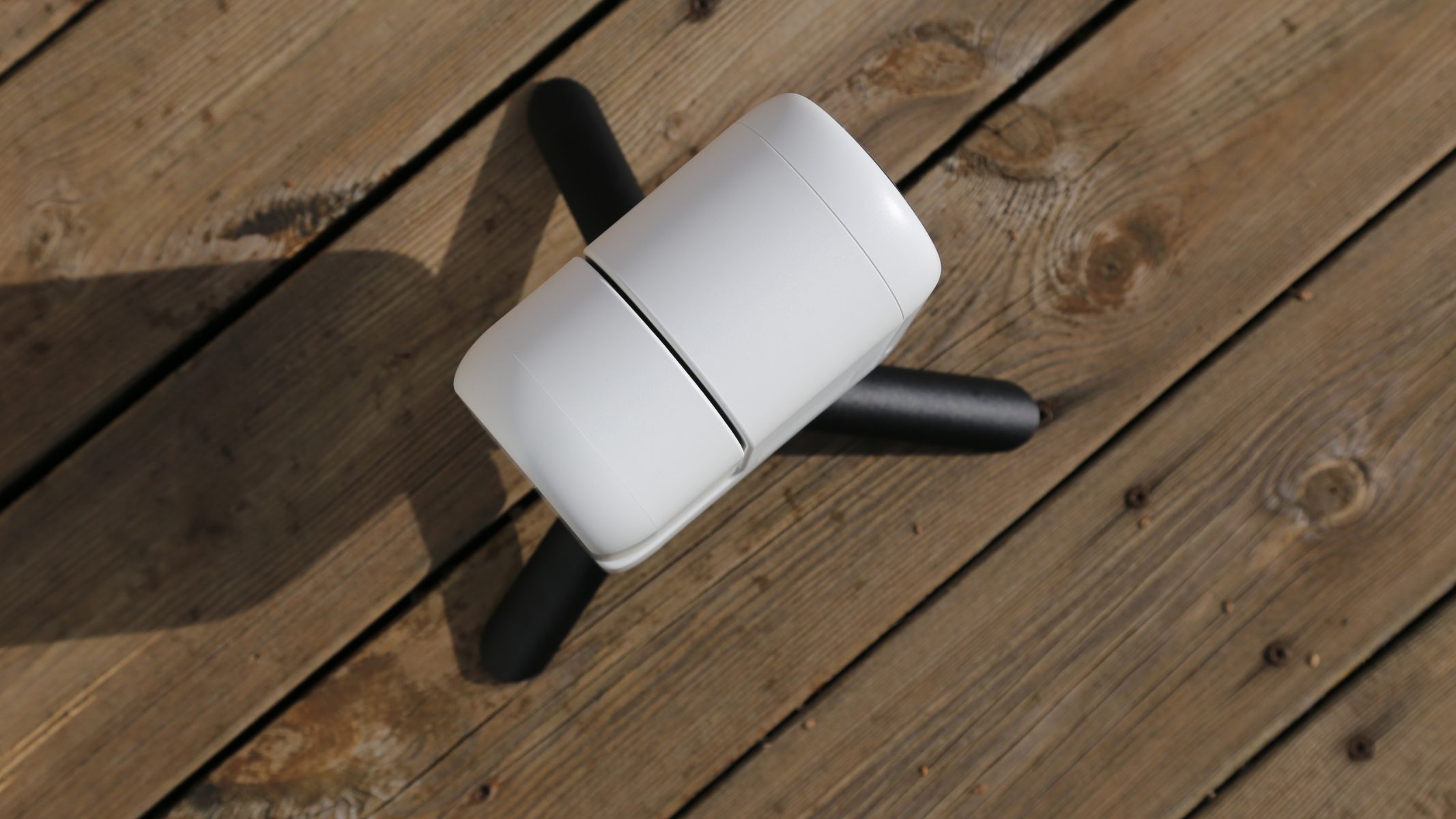 A bird's eye view of the ZWO Seestar S30 Pro on a wooden table.