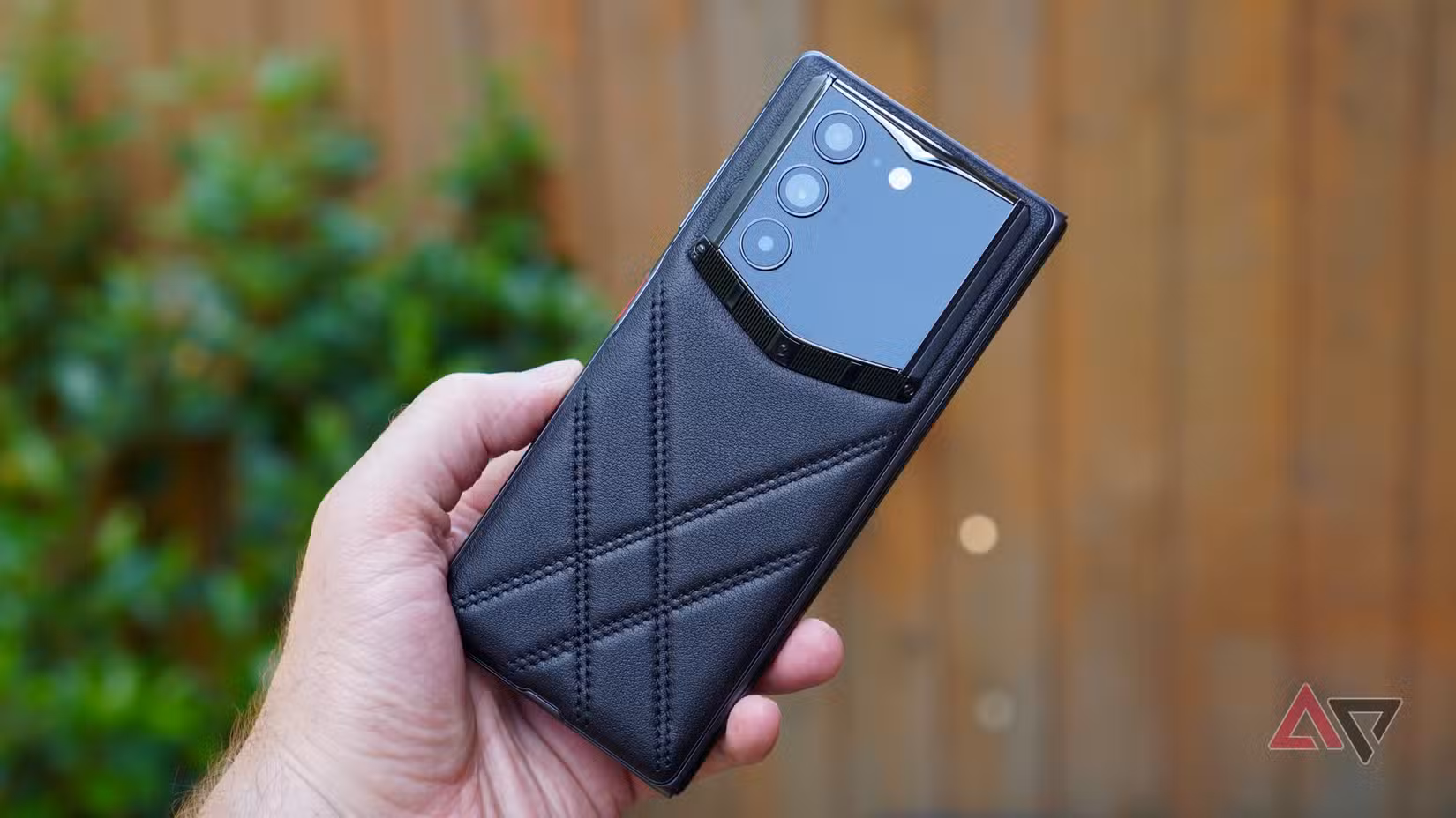 A person holding the Vertu Alphafold